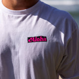 Fun Day Surf Aloha Tee in White chest print close-up, lifestyle view