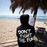 Fun Day Surf DFTF Hoodie in Black back graphic worn on the beach, lifestyle view