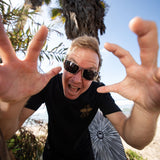Fun Day Surf Framework Fill Tee in Black worn at the beach, lifestyle view