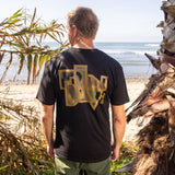 Fun Day Surf Framework Fill Tee in Black back graphic worn at the beach, lifestyle view