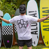 Fun Day Surf Framework Tee in White back graphic in front of surfboards, lifestyle view