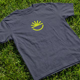Fun Day Surf Fun Sun Tee in Harbor Blue laid flat on grass, lifestyle view